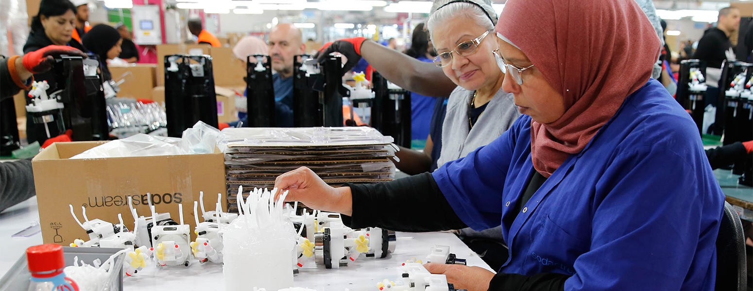 Israeli and Palestinian employees work at the SodaStream factory in Rahat, Israel. Photo: Gil Cohen-Magen/AFP/Getty Images.